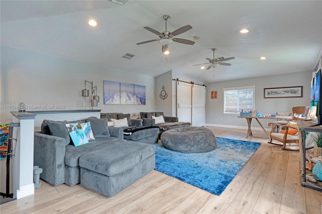 2750 SW 86th Way, Davie, FL 33328 - living area featuring a barn door, lofted ceiling, wood finished floors, ceiling fan, and baseboards
