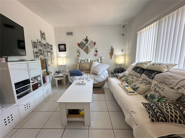 85 NW 126th St, North Miami, FL 33168 - living room with a textured ceiling and light tile patterned floors