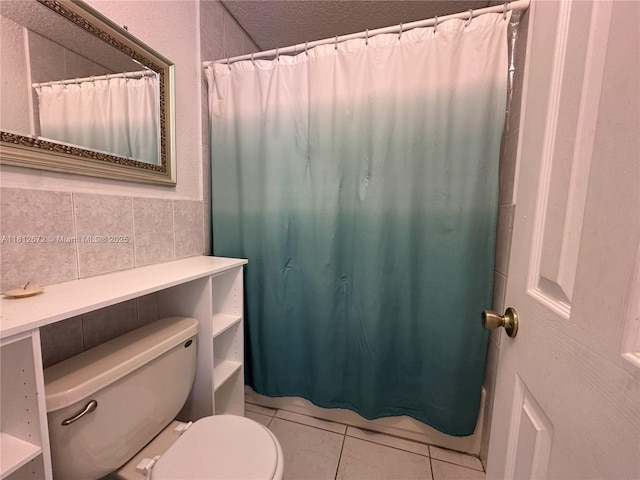 85 NW 126th St, North Miami, FL 33168 - full bathroom with toilet, tile patterned floors, and tile walls