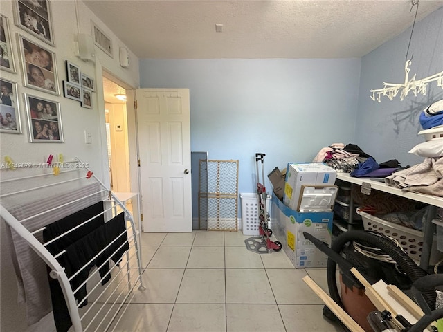 85 NW 126th St, North Miami, FL 33168 - washroom with light tile patterned floors and a textured ceiling