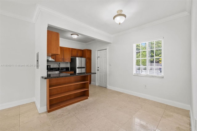 1300 Salzedo St Unit 1, Coral Gables, FL 33134 - kitchen with freestanding refrigerator, dark countertops, open shelves, a sink, and brown cabinets