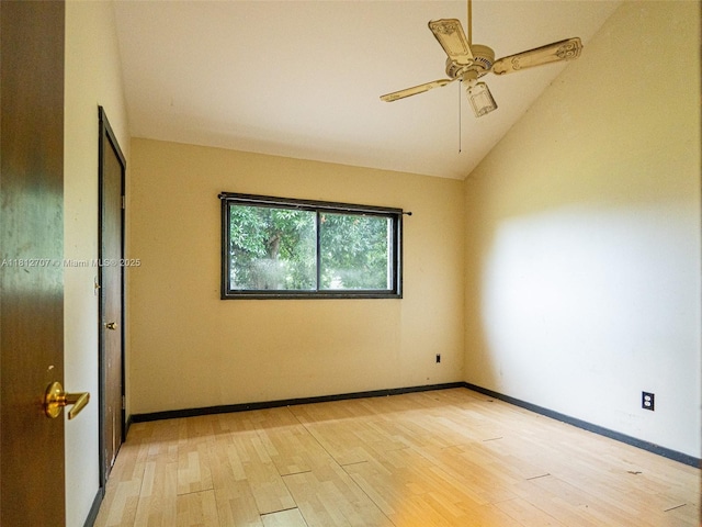 802 SE Kendall Ave, Port St Lucie, FL 34983 - spare room featuring light wood-style flooring, lofted ceiling, ceiling fan, and baseboards