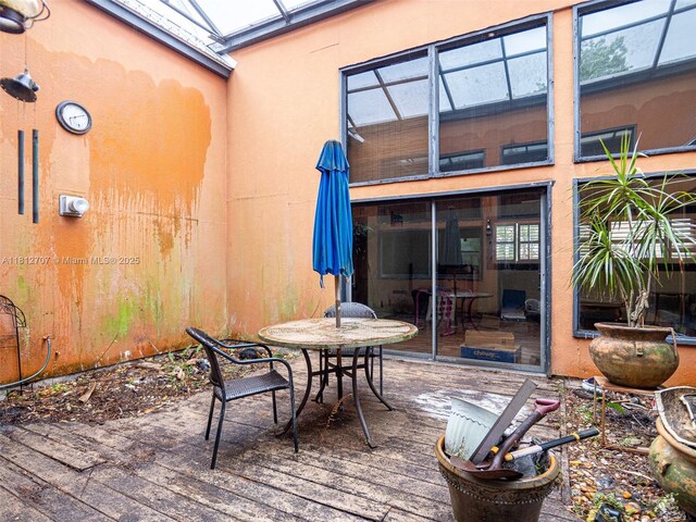 802 SE Kendall Ave, Port St Lucie, FL 34983 - wooden terrace featuring outdoor dining space