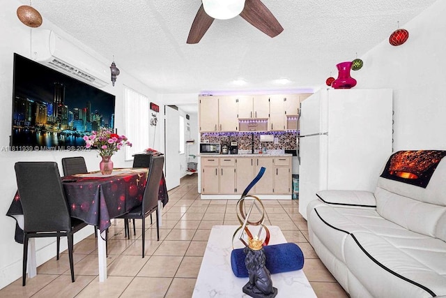 911 E 9th Pl, Hialeah, FL 33010 - living area with a textured ceiling, ceiling fan, and light tile patterned floors