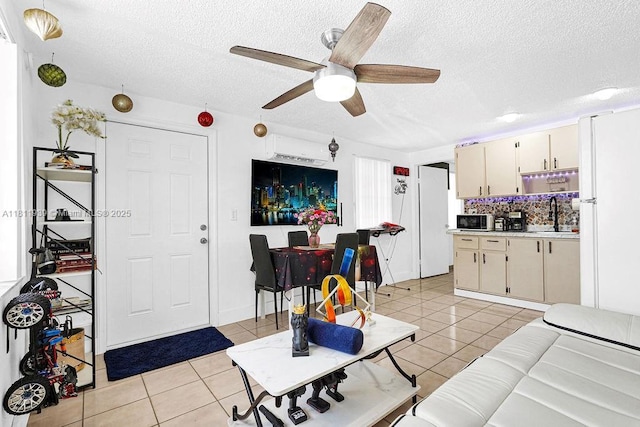 911 E 9th Pl, Hialeah, FL 33010 - living area featuring light tile patterned floors, a textured ceiling, and ceiling fan