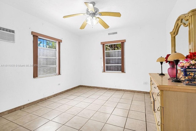 911 E 9th Pl, Hialeah, FL 33010 - empty room featuring ceiling fan, light tile patterned floors, and baseboards