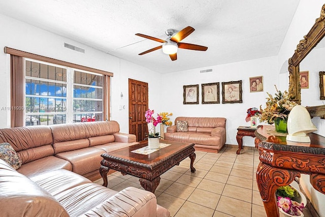 911 E 9th Pl, Hialeah, FL 33010 - living room with ceiling fan, light tile patterned floors, and a textured ceiling