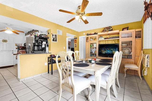 911 E 9th Pl, Hialeah, FL 33010 - dining area featuring a ceiling fan and light tile patterned floors