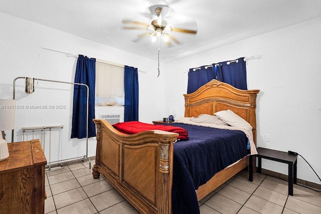 911 E 9th Pl, Hialeah, FL 33010 - bedroom featuring light tile patterned flooring, a ceiling fan, and baseboards