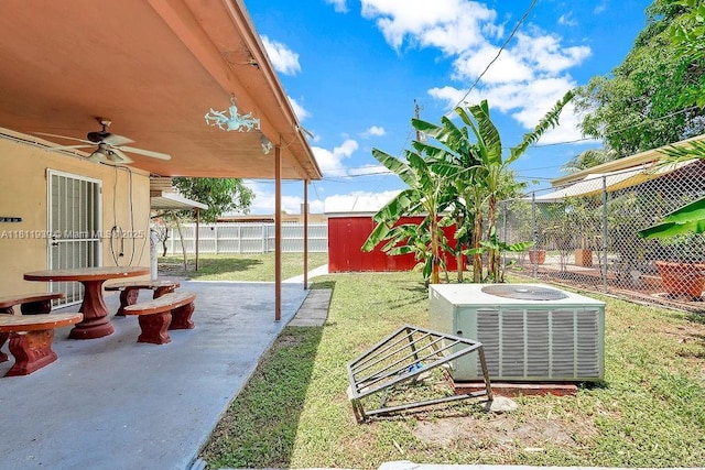 911 E 9th Pl, Hialeah, FL 33010 - view of yard featuring central AC unit, a ceiling fan, an outbuilding, and a patio