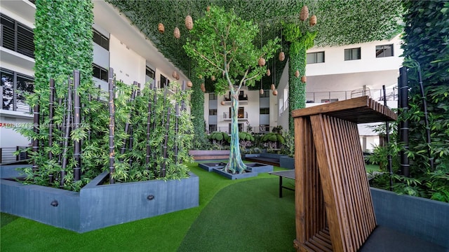 425 SE 1st St Unit 900-A, Pompano Beach, FL 33060 - view of community with a garden and a yard