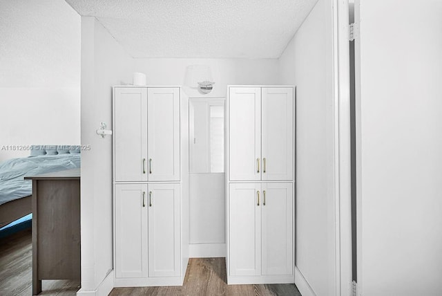 18041 Biscayne Blvd Unit 1201, Aventura, FL 33160 - bathroom featuring wood finished floors, a textured ceiling, and baseboards