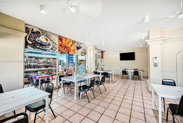 18041 Biscayne Blvd Unit 1201, Aventura, FL 33160 - dining area featuring a ceiling fan, light tile patterned floors, and decorative columns