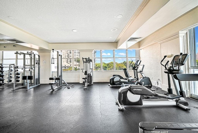 18041 Biscayne Blvd Unit 1201, Aventura, FL 33160 - workout area with a textured ceiling, crown molding, and baseboards