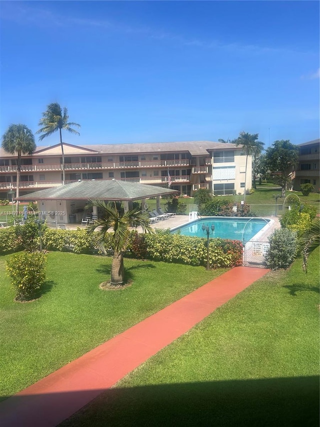 5300 Washington St Unit F215, Hollywood, FL 33021 - view of pool with a lawn