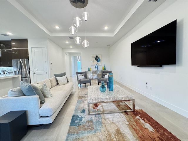 5444 SW Saint Armands Way, Westlake, FL 33470 - living room featuring a raised ceiling and baseboards