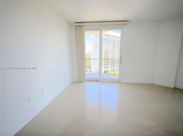 2701 SW 3rd Ave Unit 503, Miami, FL 33129 - unfurnished room with tile patterned flooring and baseboards