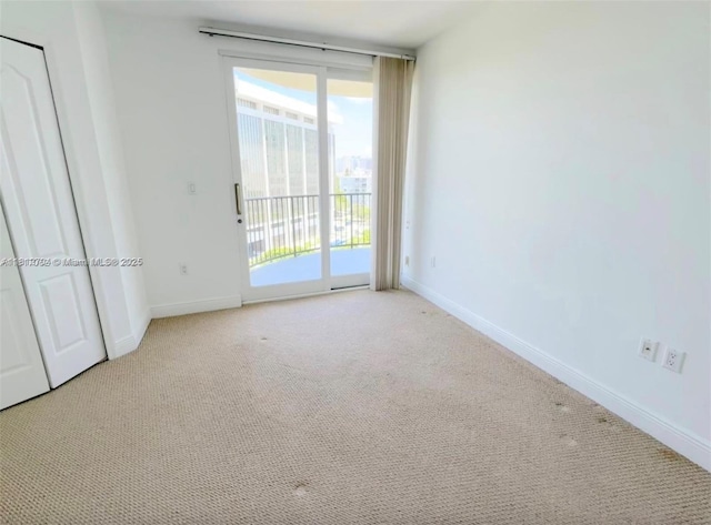 2701 SW 3rd Ave Unit 503, Miami, FL 33129 - unfurnished bedroom featuring access to outside, carpet, and baseboards