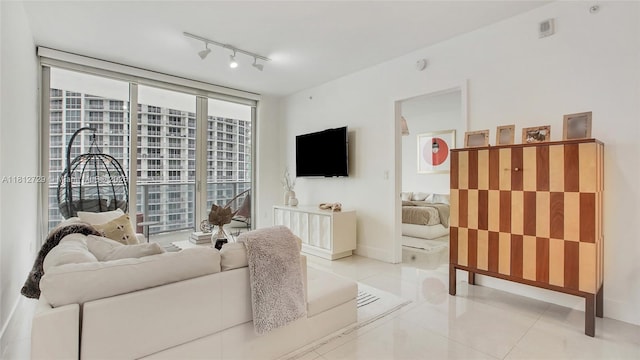 488 NE 18th St Unit 4208, Miami, FL 33132 - living room featuring light tile patterned floors, baseboards, and track lighting