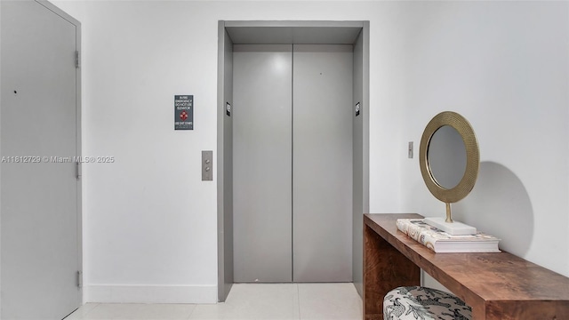 488 NE 18th St Unit 4208, Miami, FL 33132 - hall featuring elevator, tile patterned floors, and baseboards