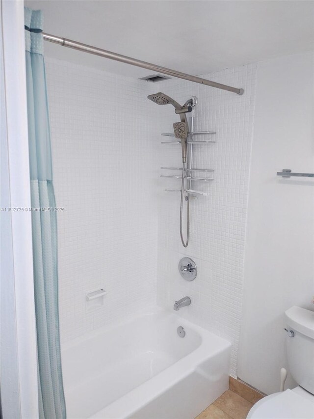 3300 N Palm Aire Dr Unit 706, Pompano Beach, FL 33069 - bathroom with shower / bath combo, toilet, and tile patterned flooring