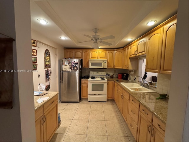 3750 NE 169th St Unit 106, North Miami Beach, FL 33160 - kitchen with white appliances, a sink, a raised ceiling, a ceiling fan, and light tile patterned floors