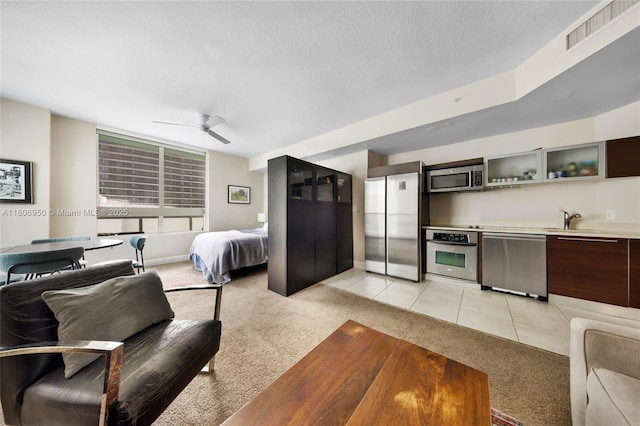1900 N Bayshore Dr Unit 3605, Miami, FL 33132 - bedroom featuring light carpet, freestanding refrigerator, a sink, a ceiling fan, and a textured ceiling
