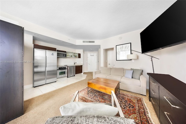 1900 N Bayshore Dr Unit 3605, Miami, FL 33132 - living area featuring light colored carpet, light tile patterned floors, and baseboards