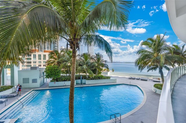 1900 N Bayshore Dr Unit 3605, Miami, FL 33132 - community pool featuring a water view and a patio