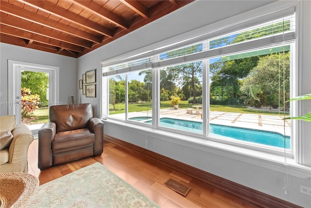 25000 SW 197th Ave, Homestead, FL 33031 - living area featuring wood ceiling with exposed beams, baseboards, and wood finished floors