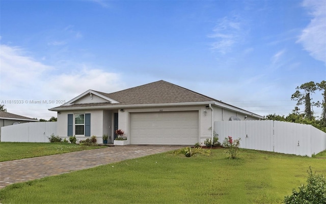 3021 June Cir Fl, LaBelle, FL 33935 - single story home featuring an attached garage, driveway, stucco siding, and roof with shingles