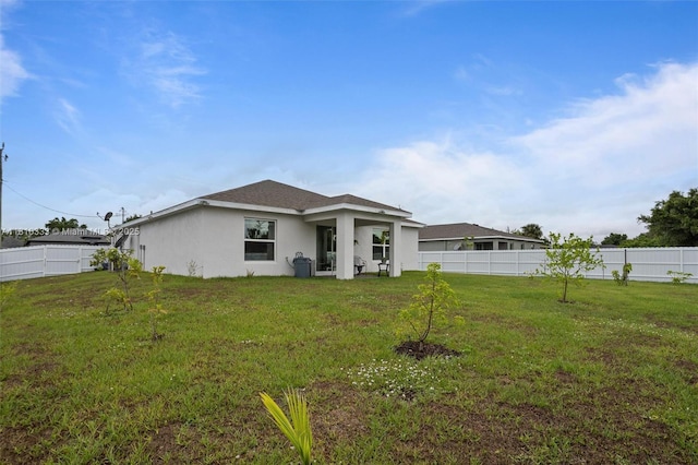 3021 June Cir Fl, LaBelle, FL 33935 - back of property featuring stucco siding