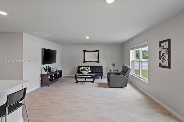 3021 June Cir Fl, LaBelle, FL 33935 - living room with recessed lighting, baseboards, and light wood-type flooring