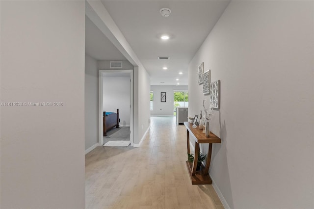 3021 June Cir Fl, LaBelle, FL 33935 - hallway featuring light wood finished floors, recessed lighting, and baseboards