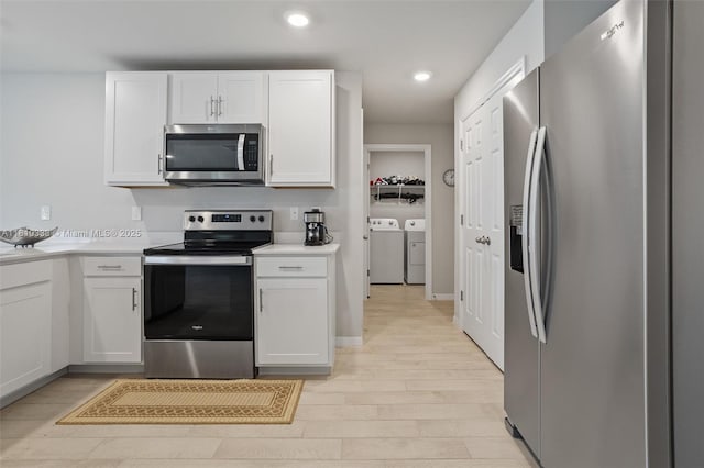 3021 June Cir Fl, LaBelle, FL 33935 - kitchen featuring appliances with stainless steel finishes, washing machine and clothes dryer, white cabinets, light countertops, and recessed lighting