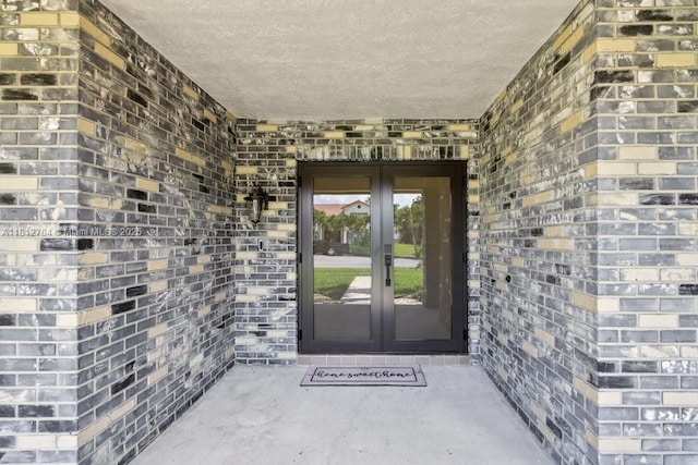 20141 NW 8th St, Pembroke Pines, FL 33029 - view of exterior entry featuring french doors and brick siding