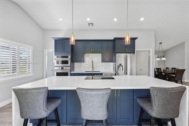 20141 NW 8th St, Pembroke Pines, FL 33029 - kitchen with appliances with stainless steel finishes, a sink, blue cabinetry, light countertops, and recessed lighting