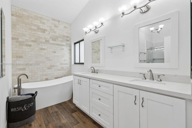20141 NW 8th St, Pembroke Pines, FL 33029 - full bath featuring a freestanding bath, double vanity, wood finished floors, and a chandelier