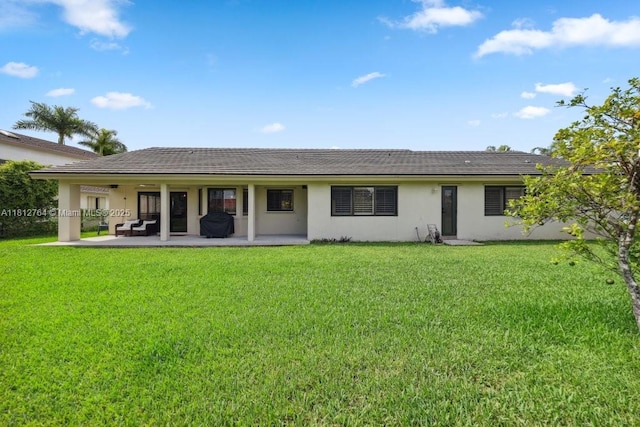 20141 NW 8th St, Pembroke Pines, FL 33029 - back of house with a yard, stucco siding, and a patio area