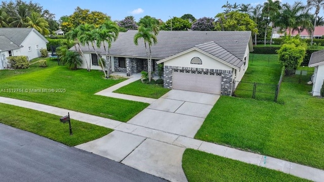 20141 NW 8th St, Pembroke Pines, FL 33029 - single story home with stone siding, an attached garage, driveway, stucco siding, and a tiled roof
