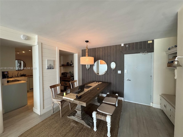 5161 Collins Ave Unit 315, Miami Beach, FL 33140 - dining area featuring wood walls and wood finished floors
