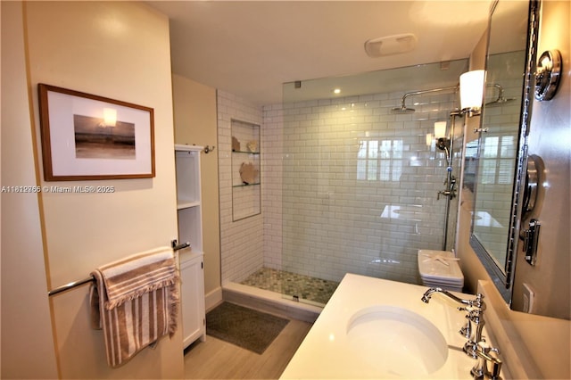 5161 Collins Ave Unit 315, Miami Beach, FL 33140 - full bathroom featuring a tile shower, wood finished floors, and vanity