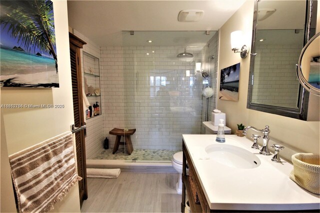 5161 Collins Ave Unit 315, Miami Beach, FL 33140 - bathroom featuring a stall shower, vanity, and wood finished floors
