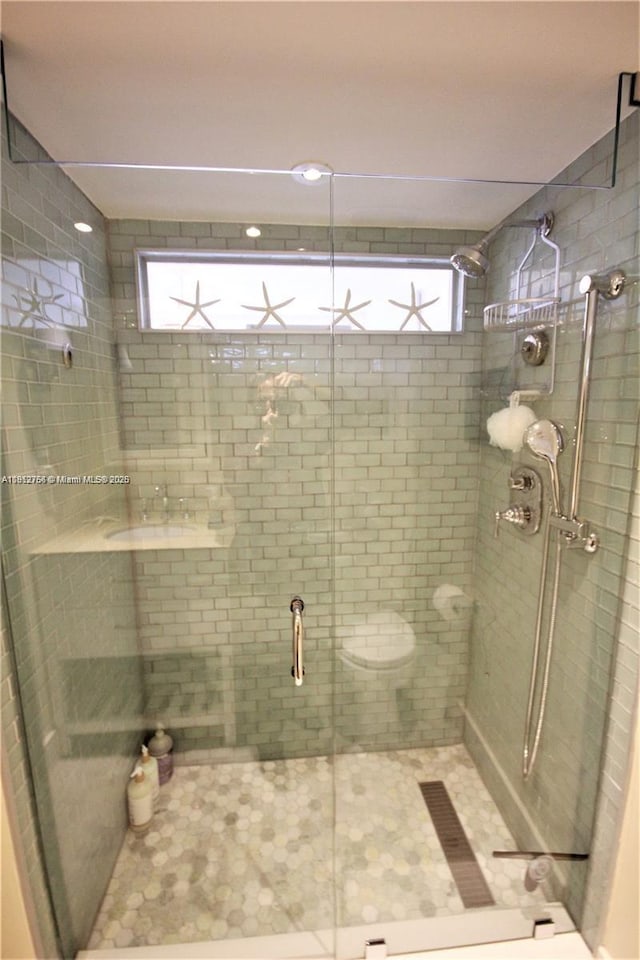 5161 Collins Ave Unit 315, Miami Beach, FL 33140 - bathroom featuring a shower stall and tile patterned flooring