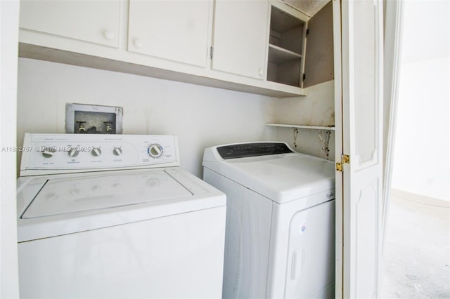 1006 NE 24th Ave Unit 190, Hallandale Beach, FL 33009 - laundry area with washing machine and dryer and cabinet space
