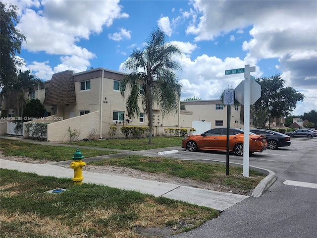 1061 NW 80th Ave Unit J, Margate, FL 33063 - view of building exterior with uncovered parking