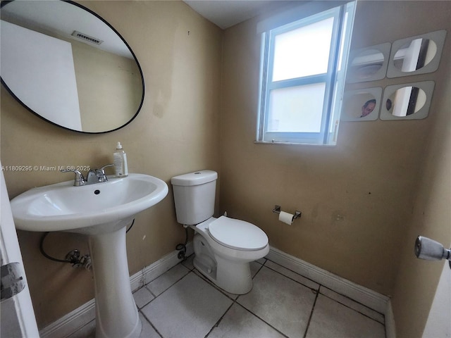 1061 NW 80th Ave Unit J, Margate, FL 33063 - bathroom featuring toilet and tile patterned flooring