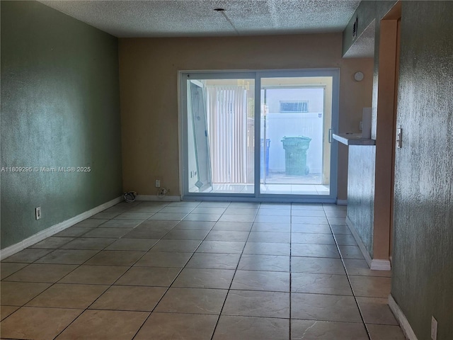 1061 NW 80th Ave Unit J, Margate, FL 33063 - unfurnished room with light tile patterned floors and a textured ceiling