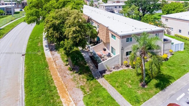 1061 NW 80th Ave Unit J, Margate, FL 33063 - unfurnished bedroom featuring multiple closets, multiple windows, and tile patterned floors