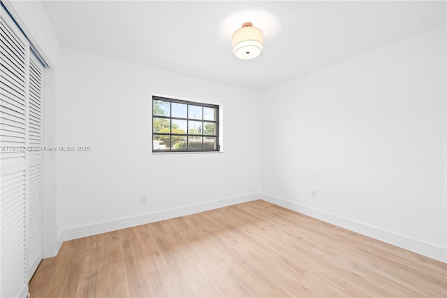 18801 NW 29th Ct, Miami Gardens, FL 33056 - unfurnished bedroom with light wood-type flooring, a closet, and baseboards